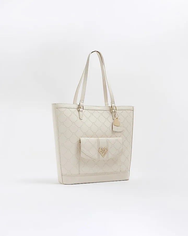 Girls cream embossed pocket shopper bag