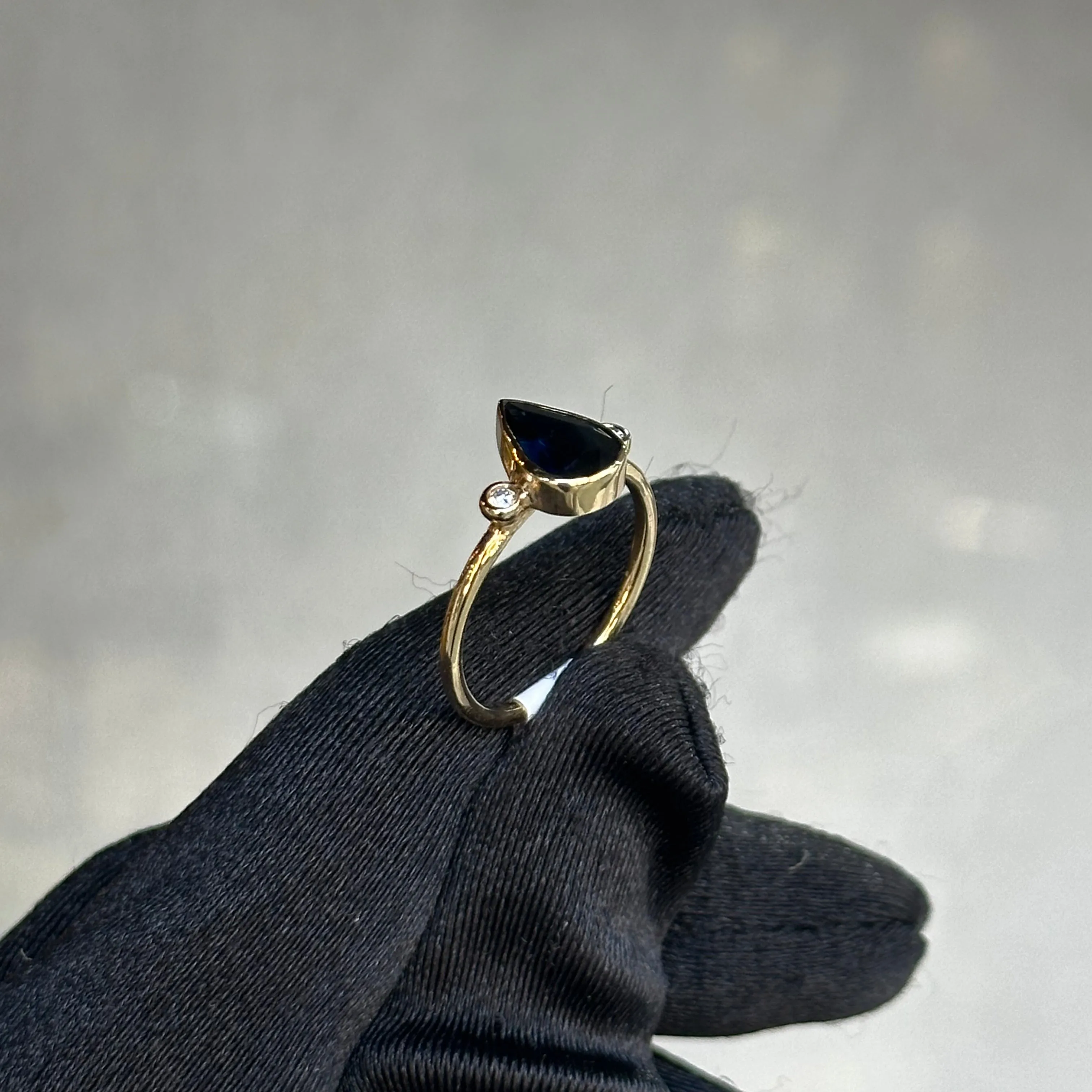 Yellow Gold Bezel Pear Shape Blue Spinel and Round Diamonds Ring